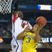 Michigan sophomore Trey Burke looks to shoot around Louisville junior Gorgui Dieng during the second half of the national championship game at the Georgia Dome in Atlanta on Monday, April 8, 2013. Melanie Maxwell I AnnArbor.com